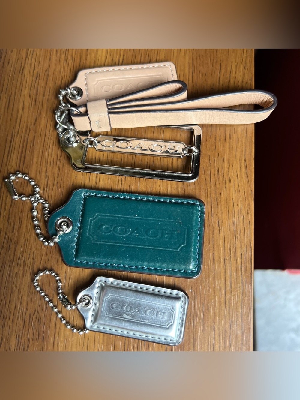 Lot of COACH Leather & Metal Tag Keychain Trio - Teal/Green, Silver, Nude/Cream